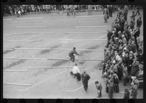 Annual barrel rolling contest. Each barrel has 200 pounds of potatoes in it. Presque Isle, Maine
