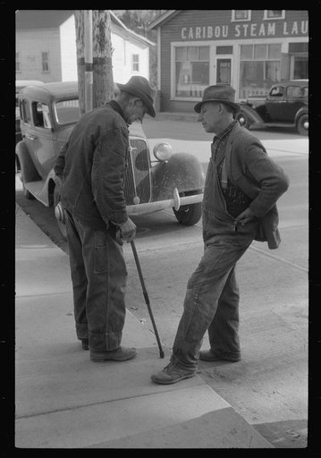 Untitled photo, possibly related to: Two potato farmers in town Saturday afternoon in Caribou, Maine