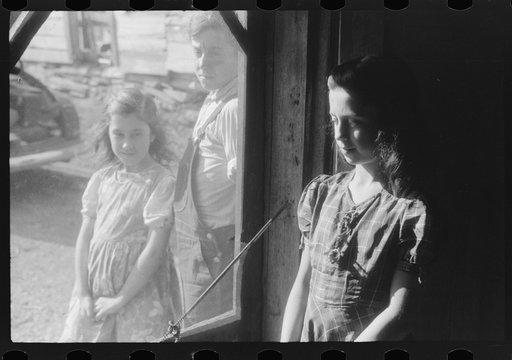 Two of the Dumond children at the back door of their home in Lille, Maine. French-Canadian potato farmers and FSA (Farm Security Administration) clients
