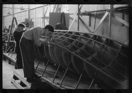 Working on the construction of a pontoon at the Vought-Sikorsky Aircraft Corporation, Stratford, Connecticut