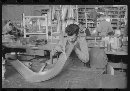 Checking dimensions on an airplane part at the Vought-Sikorsky Aircraft Corporation, Stratford, Connecticut