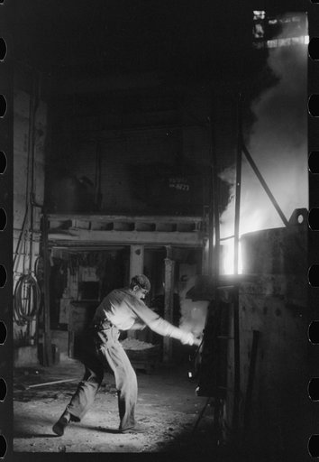 At the electric furnace in the foundry at the Farrell-Birmingham Company, Ansonia, Connecticut