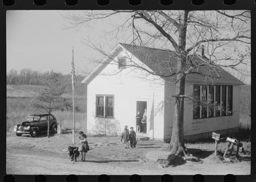 Untitled photo, possibly related to: Small children waiting for their older brothers and sisters to be let out of school for lunch. Ledyard, Connecticut