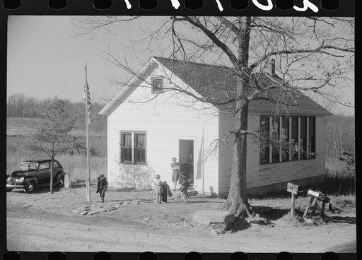 Untitled photo, possibly related to: Small children waiting for their older brothers and sisters to be let out of school for lunch. Ledyard, Connecticut