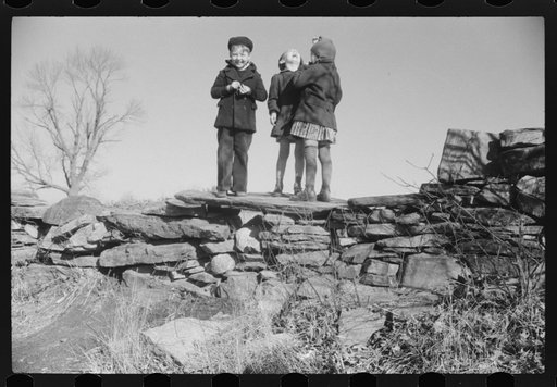 Small children waiting for their older brothers and sisters to be let out of school for lunch. Ledyard, Connecticut