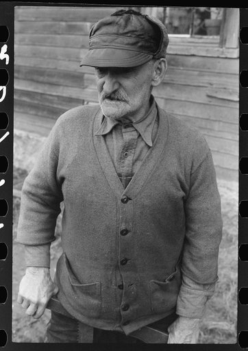 French Canadian who worked in a paper mill in Montville, Connecticut for eleven years, in front of his house