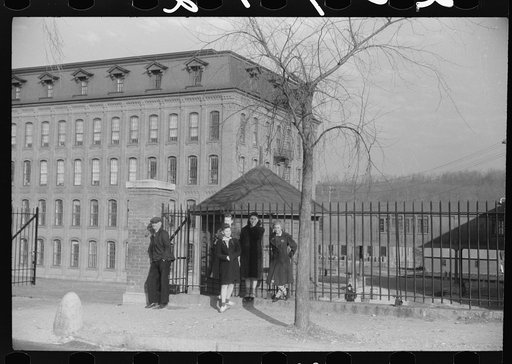 Untitled photo, possibly related to: Young workers waiting to go into work at the Penomah Mills Inc., Taftville, Connecticut