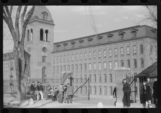Untitled photo, possibly related to: Young workers waiting to go into work at the Penomah Mills Inc., Taftville, Connecticut