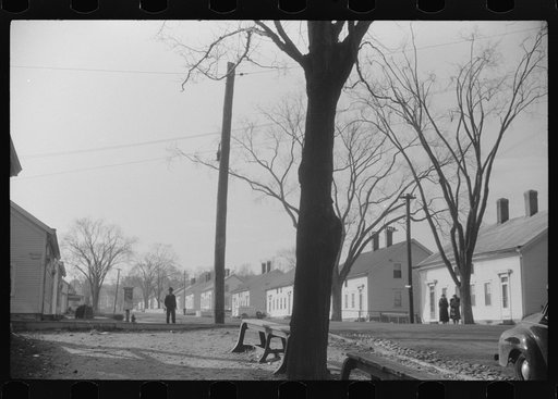 Untitled photo, possibly related to: A street in Taftville, Connecticut, during the changing of the shift at the textile mill