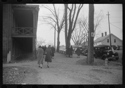 Untitled photo, possibly related to: A street in Taftville, Connecticut, during the changing of the shift at the textile mill