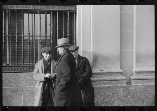 Untitled photo, possibly related to: Men outside of a bank in Woonsocket, Rhode Island