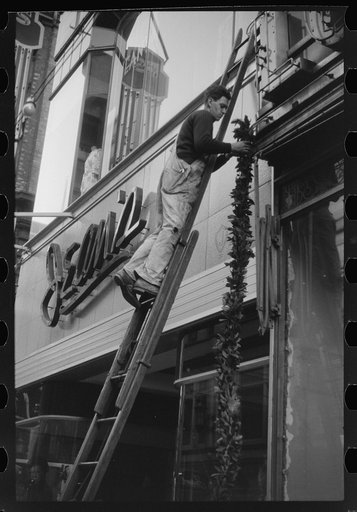 Hanging Christmas decorations in Providence, Rhode Island