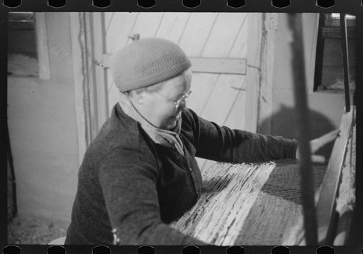 Mrs. Simon Kertulla [i.e. Mary Kerttula], working at her old fashioned loom. Finnish poultry farmer. Foster, Rhode Island