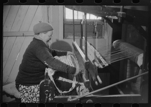 Mrs. Simon Kertulla [i.e. Mary Kerttula], working at her old fashioned loom. Finnish poultry farmer. Foster, Rhode Island