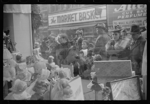 Window shoppers watching toy display in downtown Providence, Rhode Island