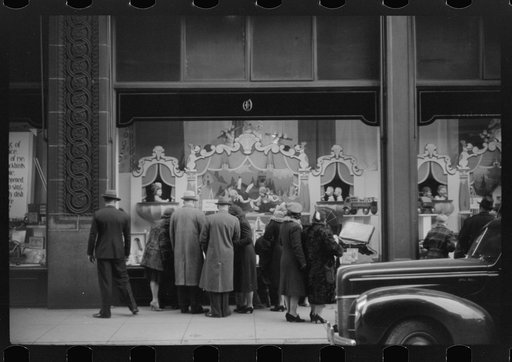 Window shoppers watching toy display in downtown Providence, Rhode Island