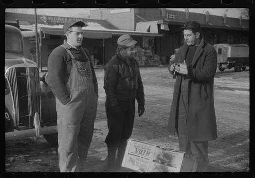 Untitled photo, possibly related to: Farmer at the Governor Dyer market keeping warm around a fire, Providence, Rhode Island