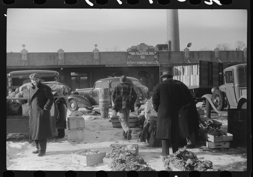 Untitled photo, possibly related to: Farmer at the Governor Dyer market keeping warm around a fire, Providence, Rhode Island