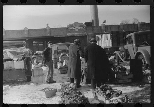 Untitled photo, possibly related to: Farmer at the Governor Dyer market keeping warm around a fire, Providence, Rhode Island