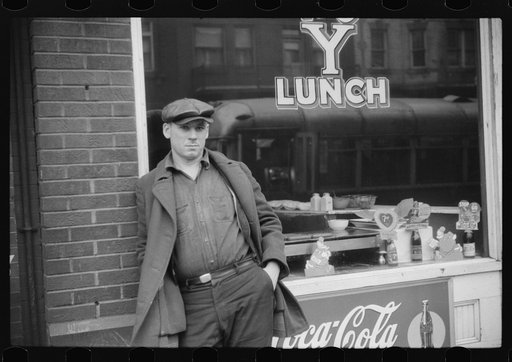 Steel worker waiting for a bus in Aliquippa, Pennsylvania