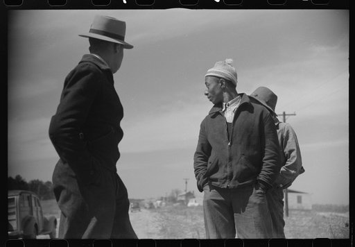 Untitled photo, possibly related to: Negro youngsters watching the construction of the prefabricated houses built by the FSA (Farm Security Administration) for farmers moved out of the Camp Croft area. Near Pacolet, South Carolina