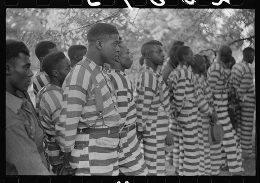 Convicts from the Greene County prison camp at the funeral of their warden who was killed in an automobile accident, Georgia