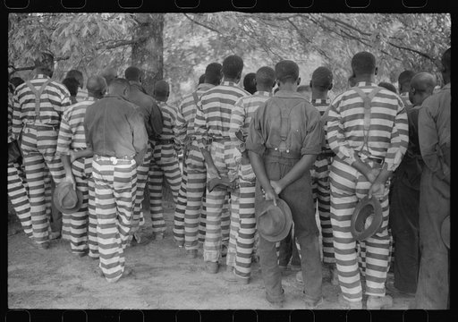 Convicts from the Greene County prison camp at the funeral of their warden who was killed in an automobile accident, Georgia