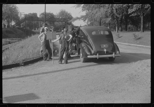 Untitled photo, possibly related to: Mill workers who lived largely in rural areas being taken through CIO picket line at a textile mill in Greensboro, Georgia. The lockout lasting about three months ending in a signed contract