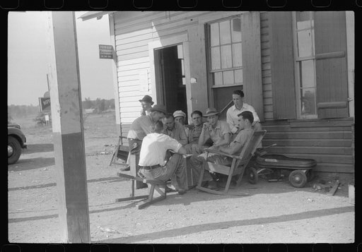 Playing cards at a filling station in Childersburg, Alabama