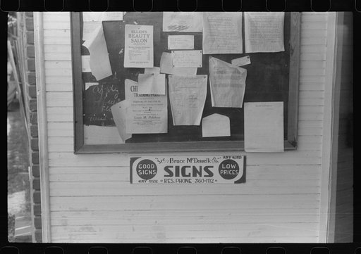 Signs on the post office bulletin board in Childersburg, Alabama