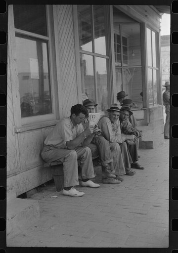 Workers, some of them unemployed, on the main street of Childersburg, Alabama