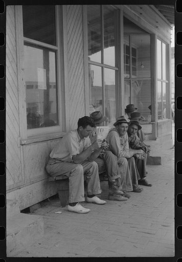 Untitled photo, possibly related to: Workers, some of them unemployed, on the main street of Childersburg, Alabama