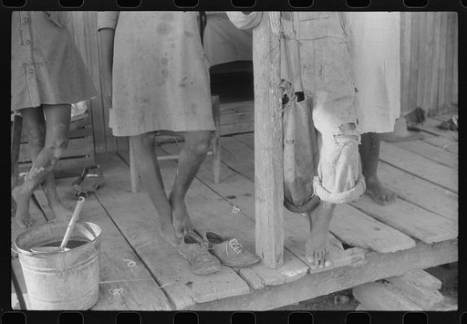 Untitled photo, possibly related to: Feet of Negro children on a farm near Greensboro, Alabama