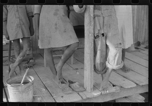 Feet of Negro children on a farm near Greensboro, Alabama