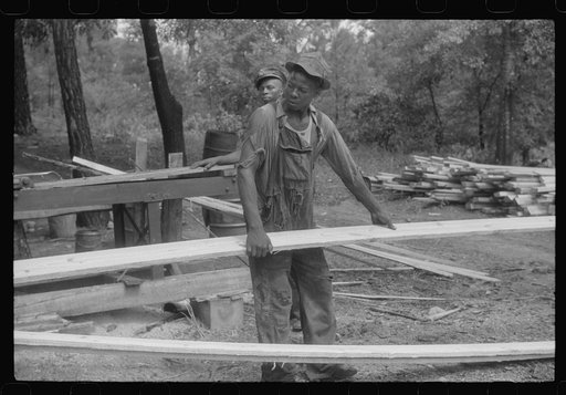 Negro worker at a small sawmill works in southern Greene County, Georgia