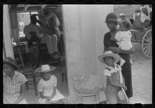 Saturday afternoon outside of a Negro store and barbershop in Union Point, Greene County, Georgia