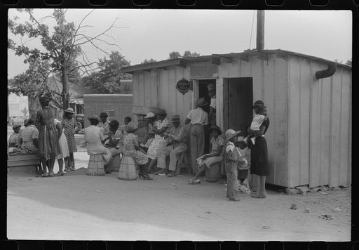 Saturday afternoon outside of a Negro store and barbershop in Union Point, Greene County, Georgia