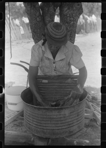 Untitled photo, possibly related to: Tenant farmer's wife washing clothes, Greene County, Georgia