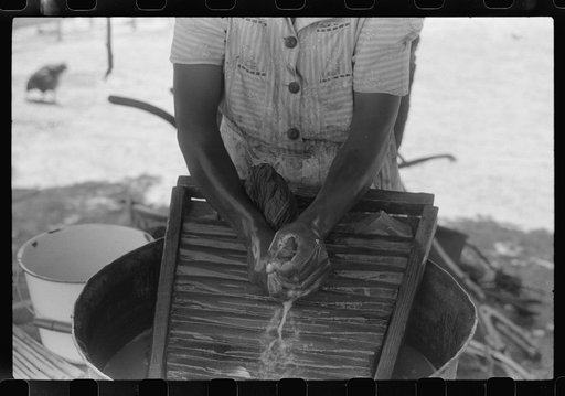 Untitled photo, possibly related to: Tenant farmer's wife washing clothes, Greene County, Georgia
