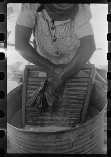 Tenant farmer's wife washing clothes, Greene County, Georgia
