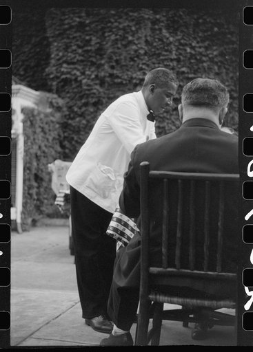 Untitled photo, possibly related to: Waiter in a restaurant in Washington, D.C.