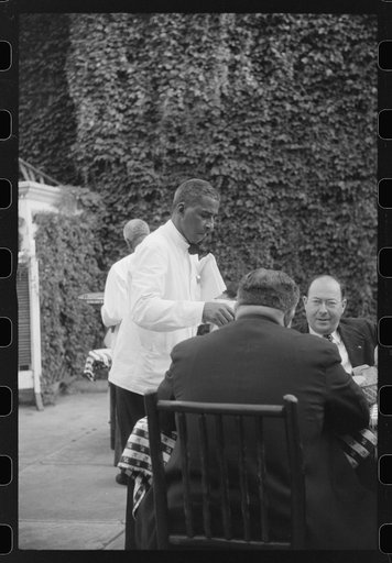 Untitled photo, possibly related to: Waiter in a restaurant in Washington, D.C.