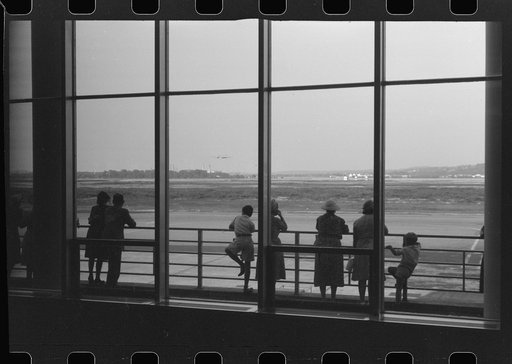 Untitled photo, possibly related to: Washington, D.C. Watching the planes takeoff through the windows of the lobby of the municipal airport