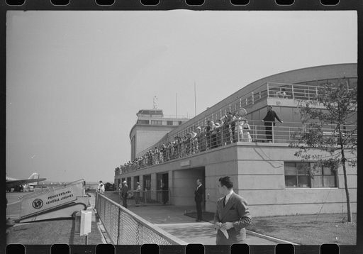 Washington, D.C. Visitors watching planes at municipal airport