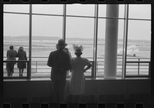 Washington, D.C. Watching the planes takeoff through the windows of the lobby of the municipal airport