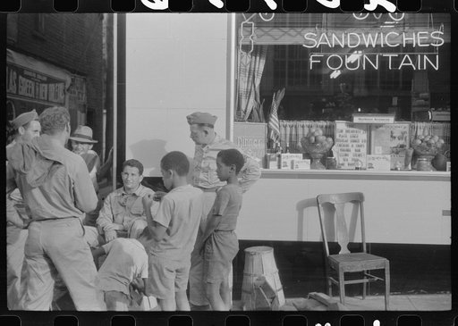 Untitled photo, possibly related to: Soldiers getting their shoes shined in Fredericksburg, Virginia