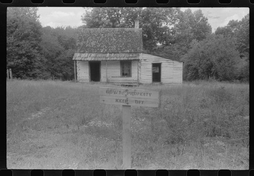 Government property sign at an abandoned house in the area taken over by the army for a maneuver ground. Caroline County, Virginia