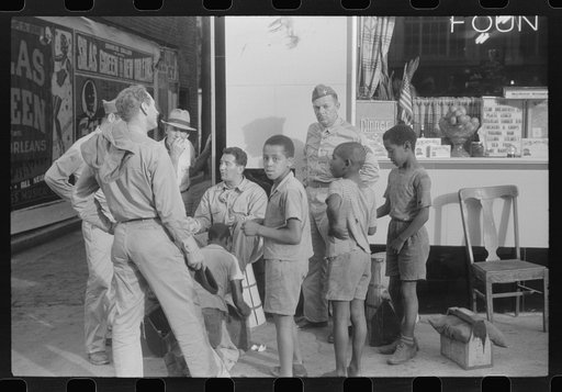 Untitled photo, possibly related to: Soldiers getting their shoes shined in Fredericksburg, Virginia