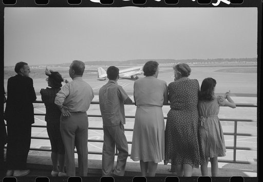 Untitled photo, possibly related to: Visitors watching a plane take off at the municipal airport in Washington, D.C.