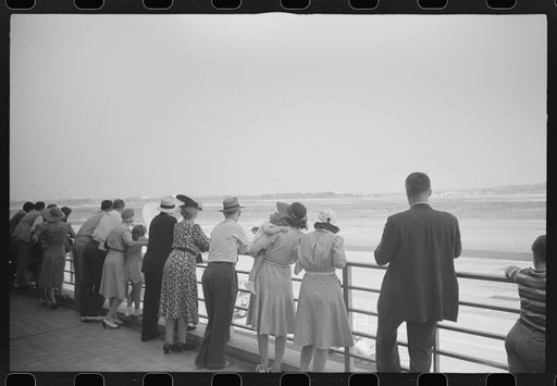 Untitled photo, possibly related to: Visitors watching a plane take off at the municipal airport in Washington, D.C.